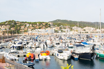 Marina with small boats moored at the quay in Sant Feliu de Gixols, Catalonia, Spain