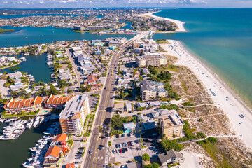 Florida. Madeira Beach Florida. Gulf of Mexico or ocean beach, Hotels and Resorts. John's Pass Village and Boardwalk. Turquoise color of salt water. American shore. Summer or Autumn vacation.