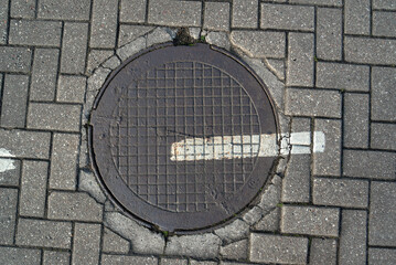 Sewer hatch on a street.