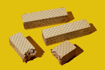 chocolate waffles on a yellow background. waffle sticks on yellow background,