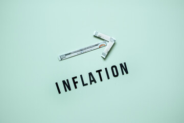 Inflation financial crisis concept. Growing up arrow from dollar banknote and word Inflation on...