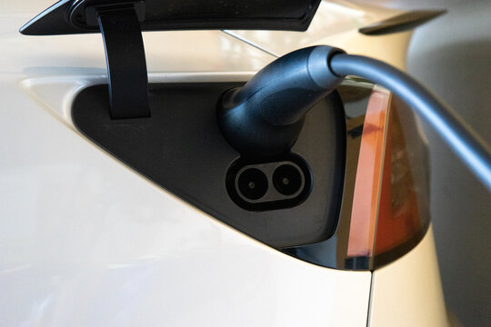 Electric vehicle on charge in the garage.