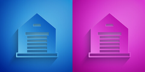 Paper cut Warehouse icon isolated on blue and purple background. Paper art style. Vector