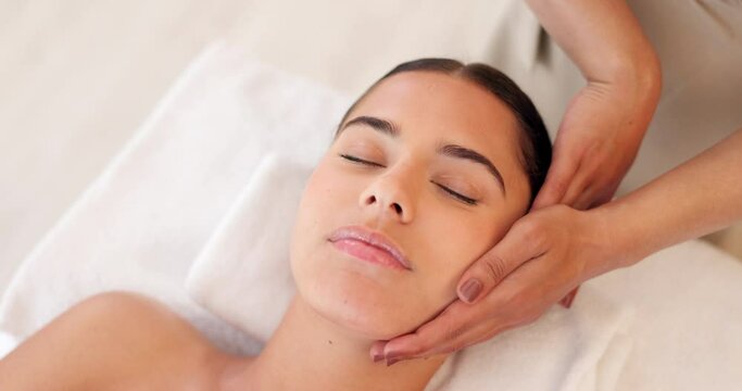 Relax, woman and spa face massage for a woman for glowing, smooth and healthy skincare treatment at a salon. Beauty, detox and hands healing a young client in a facial physical therapy session