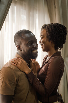 black couple laughing together