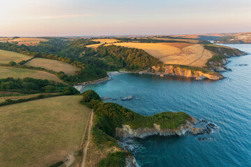 Aerial view of coastal path towards Polridmouth cove, Fowey and Polruan, Cornwall, United Kingdom.