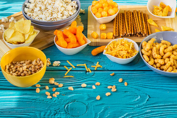 Beer salty snacks on wooden table