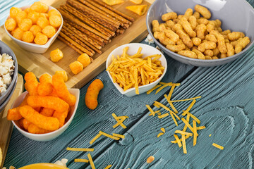 Beer salty snacks on wooden table