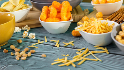 Beer salty snacks on wooden table