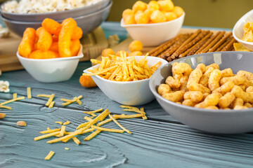 Beer salty snacks on wooden table