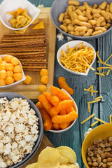 Beer salty snacks on wooden table