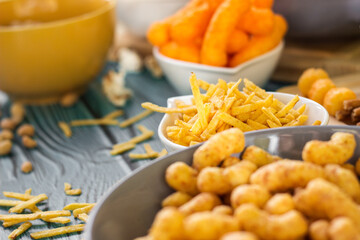 Beer salty snacks on wooden table