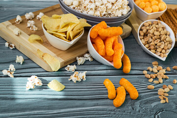 Beer salty snacks on wooden table