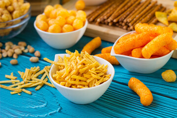 Beer salty snacks on wooden table