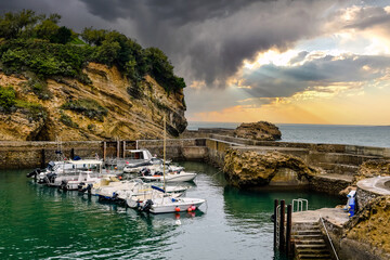 Pretty seaside landscape of Biarritz and its small port at sunset