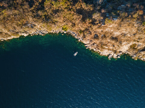 Aerial view of Boadzulu Island speed boat on Southern Lake Malawi, Mangochi, Malawi, Africa.