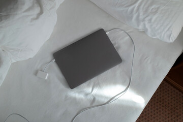 Charging laptop with power. Memory card reader is connected to the notebook. Flatley. 