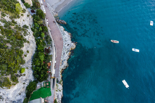 Aerial view of fishing boats along the coastline in Erchie, Amalfi Coast, Salerno, Campania, Italy.