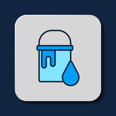 Filled outline Paint bucket icon isolated on blue background. Vector