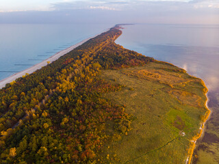 drone view of a colourful autumn sunset over the hel peninsula, the baltic sea and the gulf of...
