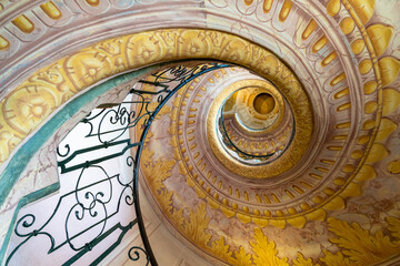 view of the multi-storey circular staircase leading from the library to the church in Melk Abbey