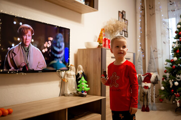 December 23, 2021 - Vinnytsia, Ukraine: A little boy watches the movie 