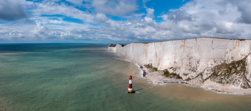 panorama view of the Beachy Head Lighthouse in the English Channel and the white cliffs of the Jurassic Coast