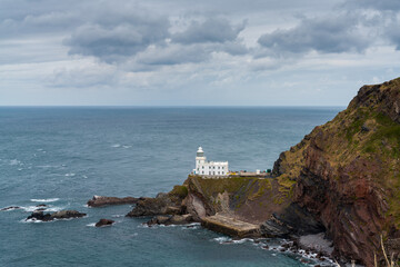 Fototapeta na wymiar view of the historic Hartland Point lighthouse and headland on Bristol Bay