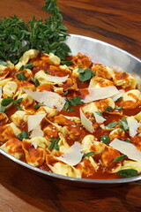 Beef ravioli in tomato sauce and Pecorino cheese