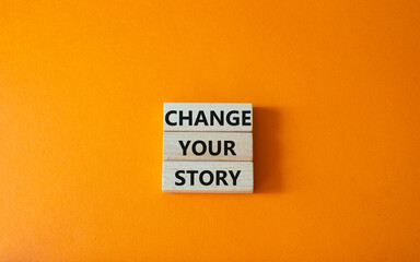 Change your story symbol. Concept word Change your story on wooden blocks. Beautiful orange background. Business and Change your story concept. Copy space