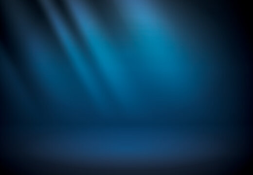 Blue studio scene background. Neutral background with soft rays. Soft studio lighting. Photostudio soft box lighting.
