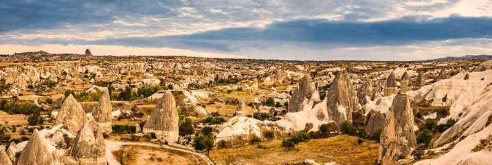 Panoramic view of Love Valley, Goreme, Turkey. Goreme is known for its fairy chimneys, eroded rock...