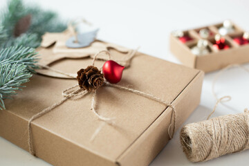 Gift cardboard box for Christmas with beautiful festive decoration. Hand made Christmas gift or a...