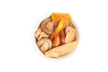 Bowl of marinated mushrooms isolated on white background, top view