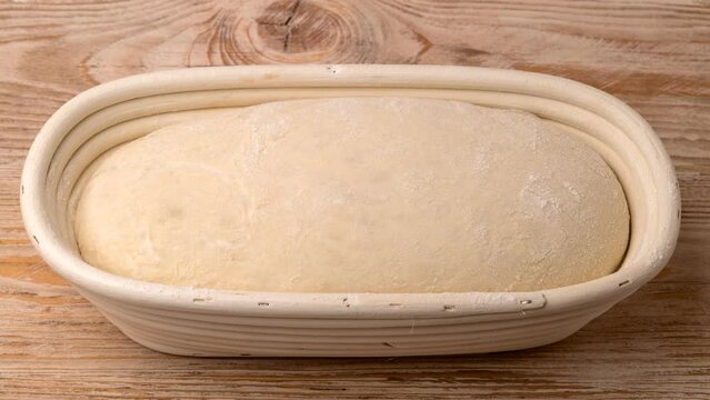 Bread rising in the wooden basket.
