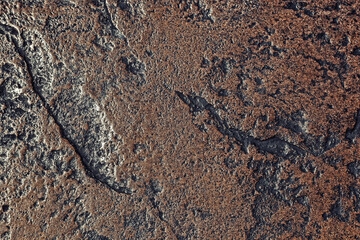 Dark stone background in rich brown and black tones. Textured backdrop to use as overlay or for added text