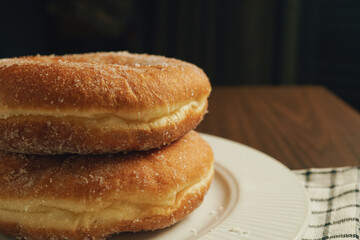 Freshly made donuts on the breakfast table - 541787848