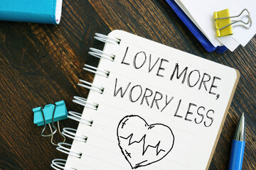 Love more worry less is shown using the text