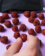 Hand grabbing spicy mexican candy