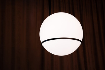 a lamp in the form of a ball on a dark background. abstraction planet