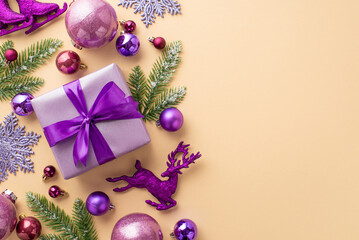 Christmas concept. Top view photo of violet giftbox with ribbon bow pink purple baubles deer...
