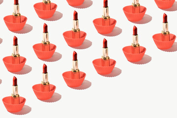 Perfect red lipsticks in silicone baking cupcake molds, creative fashion and beauty inspired pattern. 
