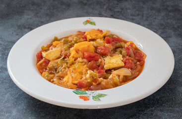Traditional turkish food menemen made by eggs and tomatoes.