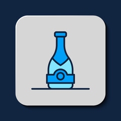 Filled outline Champagne bottle icon isolated on blue background. Vector