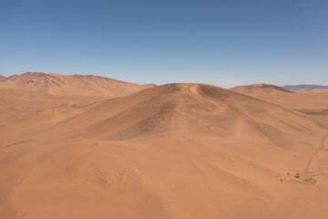 Aerial view of mountains and hills in the arid desert of Atacama, near the city of Copiapó, Chile
