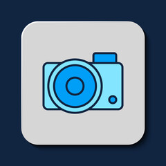 Filled outline Photo camera icon isolated on blue background. Foto camera icon. Vector