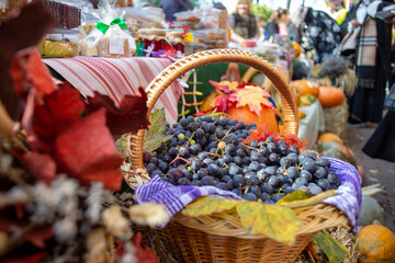 Basket full of black grapes, in a market