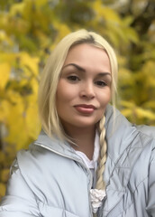 mobile photo of a beautiful blonde taking a selfie autumn