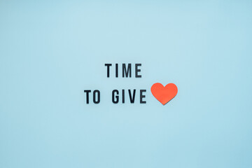 Giving Tuesday, Time to Give, Help, Donation, Support, Volunteer concept with red heart and text Time to Give on blue background. Its time to give - obrazy, fototapety, plakaty