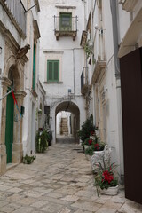 Old narrow alley in Martina Franca , Apulia Italy - obrazy, fototapety, plakaty